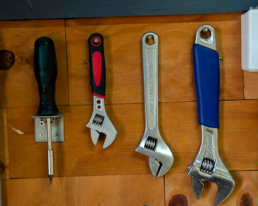 Plumbing tools neatly organised on a workbench